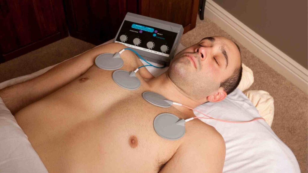 Person laying down trying tens therapy